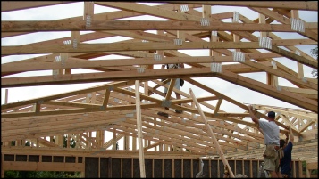 Construction Crew Putting Up PMHI Roof Trusses. Picture Courtesy California Precut Homes